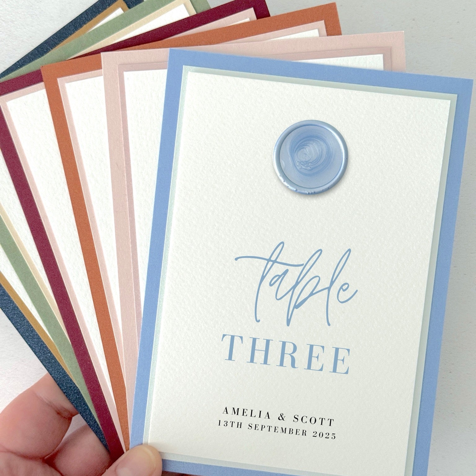 dusky blue wax seal personalised table number wedding day stationery