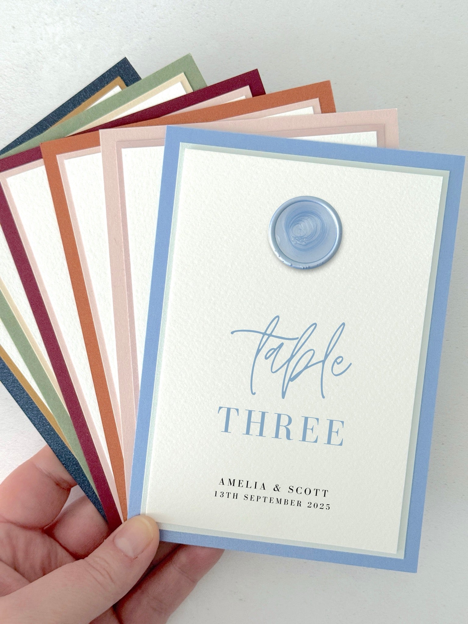 dusky blue wax seal personalised table number wedding day stationery