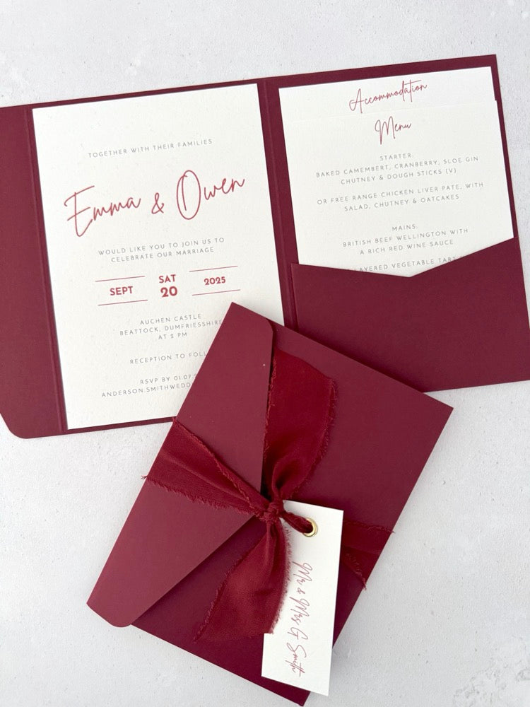 burgundy emma pocketfold wedding invite with 2 inserts for details like menu and accommodation, with silk ribbon and guest name tag