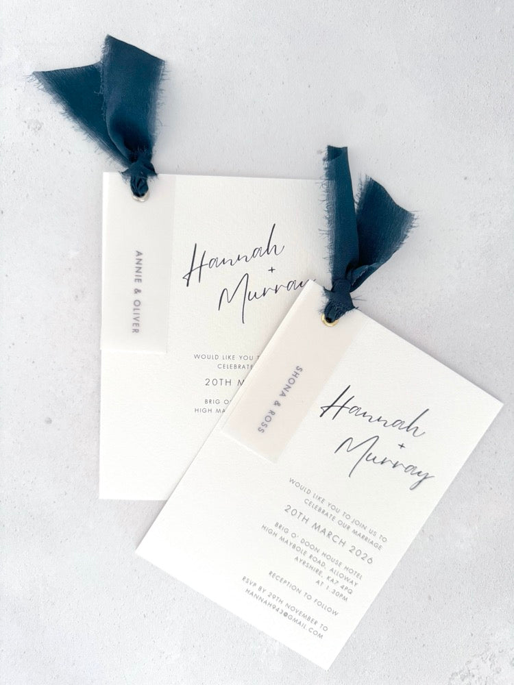 Navy silk ribbon Hannah handmade wedding invite with printed guest names on vellum tags