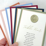Sage green wax seal Jeni individual table plan card on the day wedding stationery