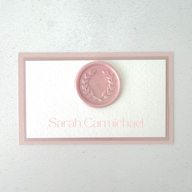 dusty pink wax seal printed place card on the day wedding stationery