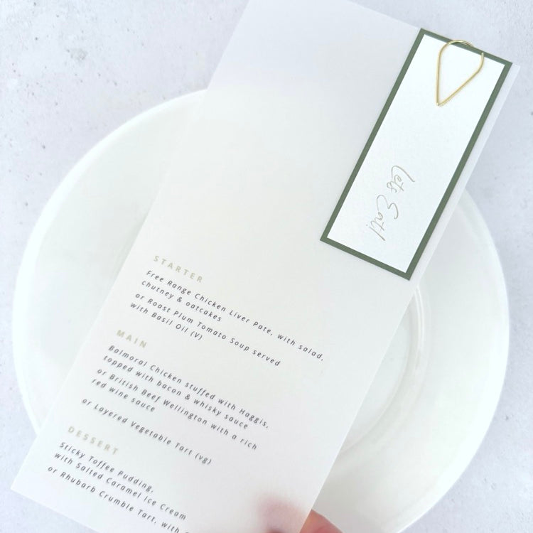 Sage green tag with gold tear drop paper clip on vellum see through paper wedding menu