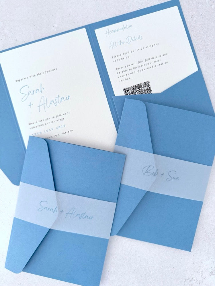 Sarah Pocketfold wedding invites with personalised vellum belly bands in duky cornflower blue