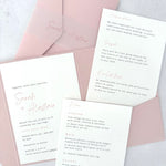 Sarah pocketfold wedding invite with 2 insert cards for menu and guest details, in blush pink, with vellum bellyband