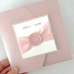 Misty rose pink square pocketfold wedding invite with pink satin ribbon and handmade wax seal
