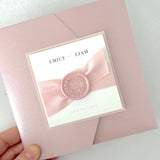 Misty rose pink square pocketfold wedding invite with pink satin ribbon and handmade wax seal