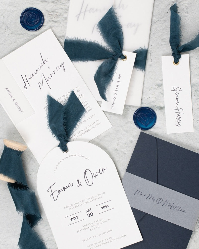 Navy wedding invites with silk ribbons and wax seals. Book in for later