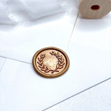 gold wax seal with olive leaf wreath
