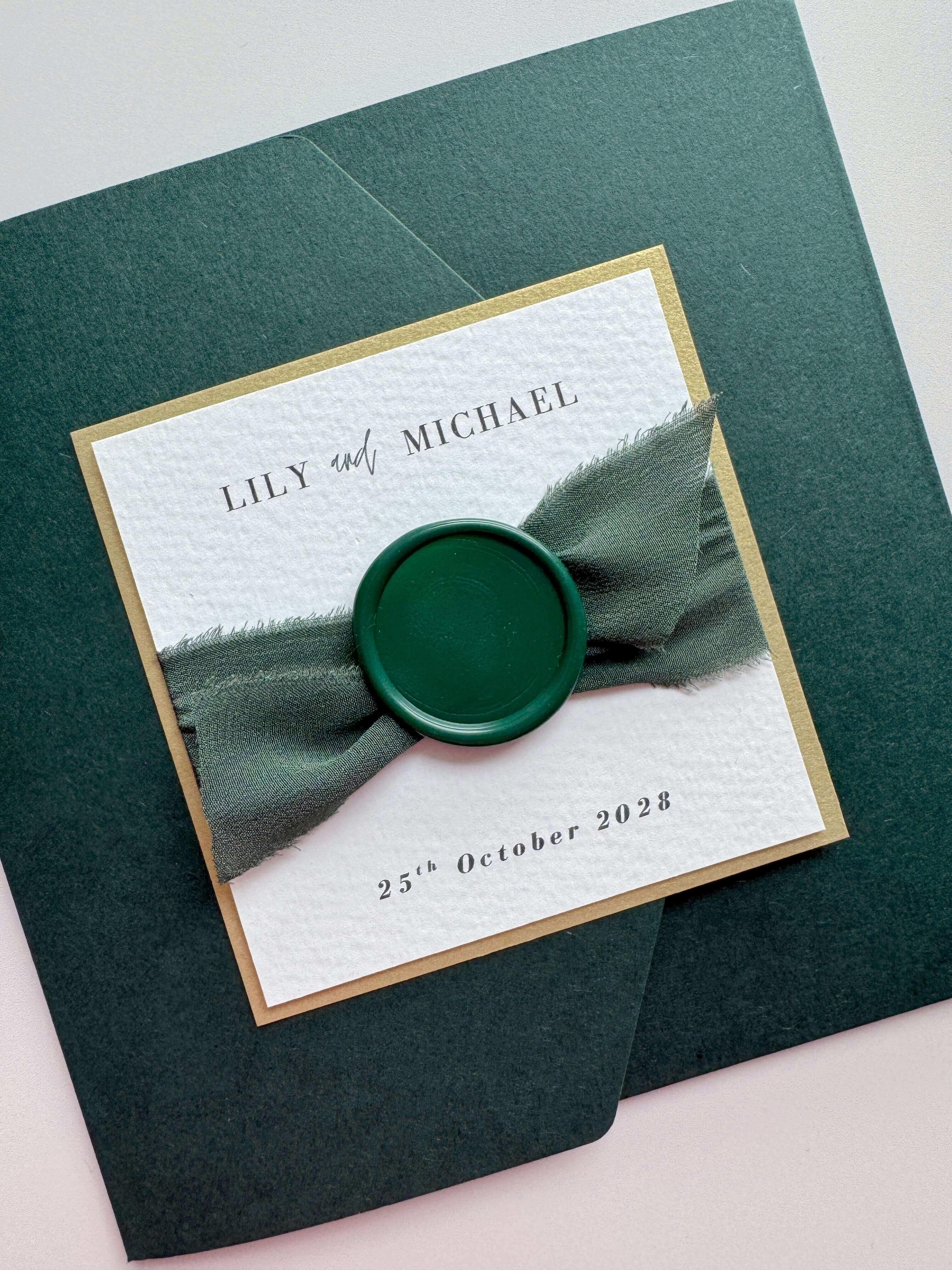 dark forest or emerald green square ailsa wedding invite with matching silk ribbon and handmade wax seal