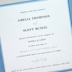 wedding invitations with printed guests names in dusty cornflower blue