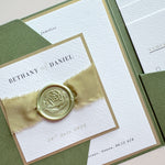 Handmade sage green ailsa wedding invite with silk ribbon and wax seal