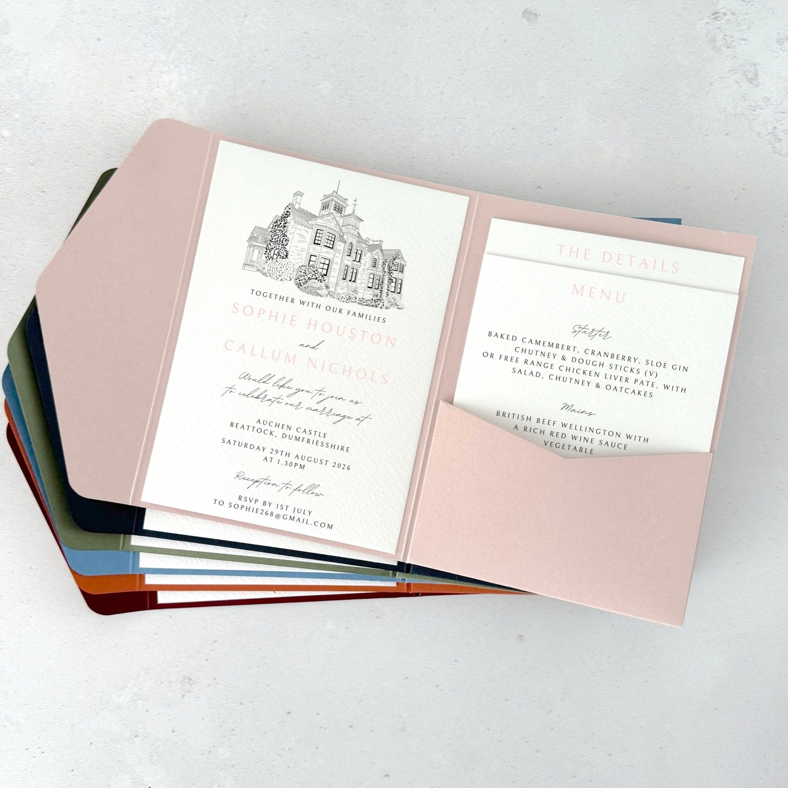 Blush pink pocket wedding invite with venue illustration of Auchen Castle, Dumfries & Galloway
