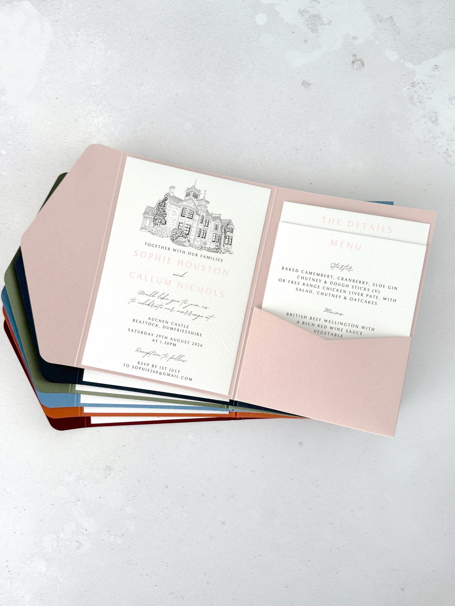Blush pink pocket wedding invite with venue illustration of Auchen Castle, Dumfries & Galloway
