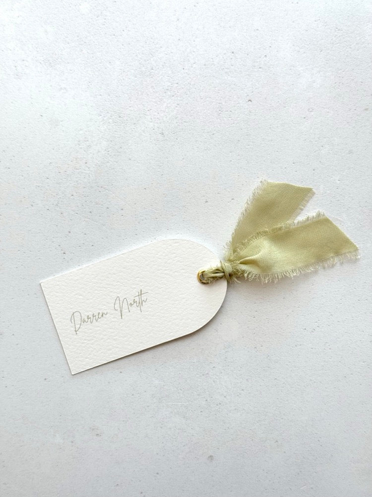 handmade arched personalised wedding place name card in sage green