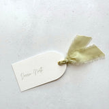 handmade arched personalised wedding place name card in sage green