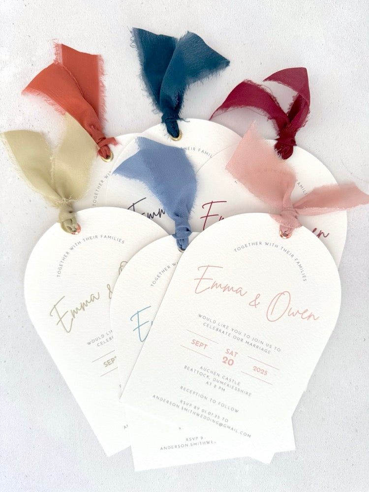 Handmade Emma arch wedding invite with silk ribbon and metal eyelet, available in 6 colours: rust, navy, burgundy, sage green, dusky blue, pink