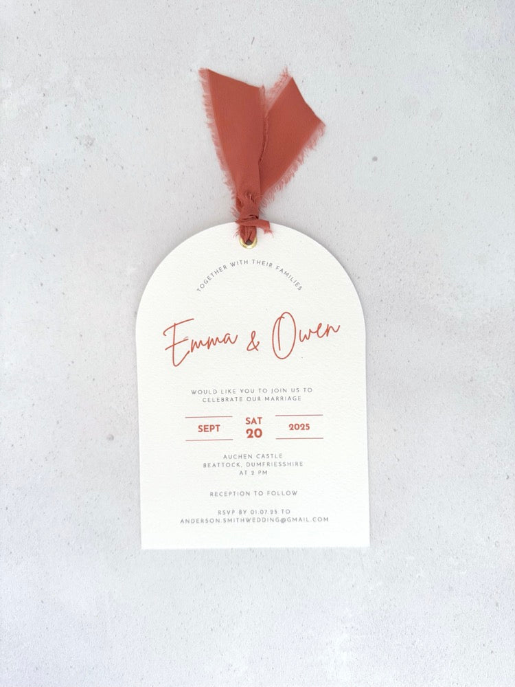 Emma arch wedding invite with rust orange silk ribbon and metal eyelet