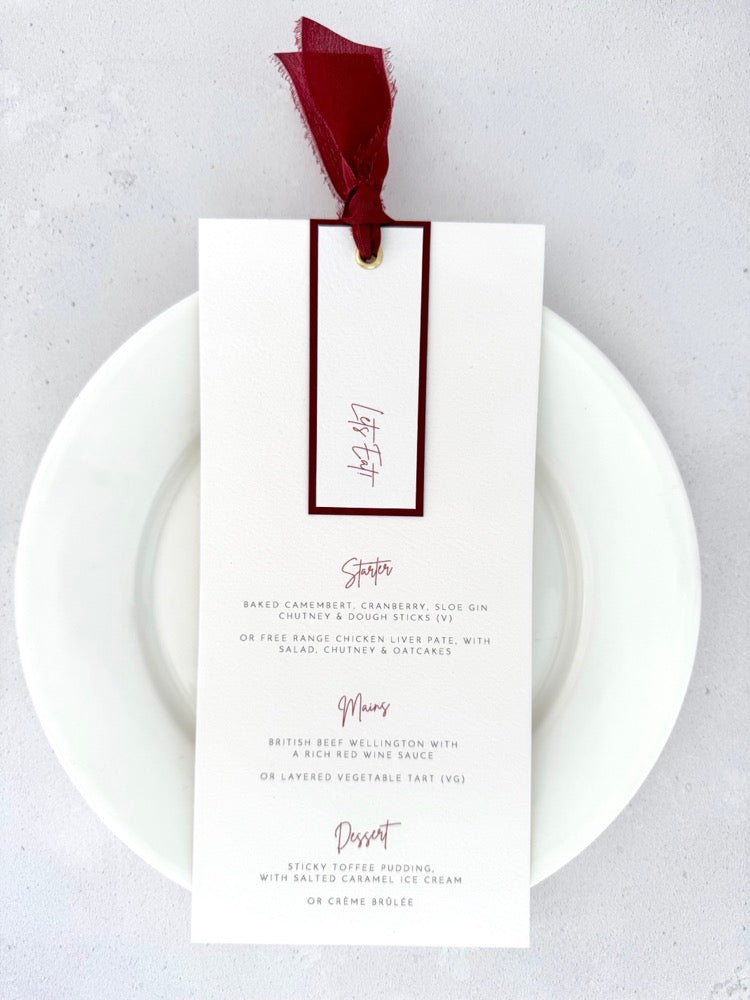 Emma wedding menu with tag, gold eyelet and burgundy silk ribbon