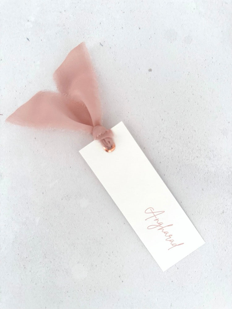 Emma place card with blush pink silk ribbon and metal eyelet on the day wedding stationery
