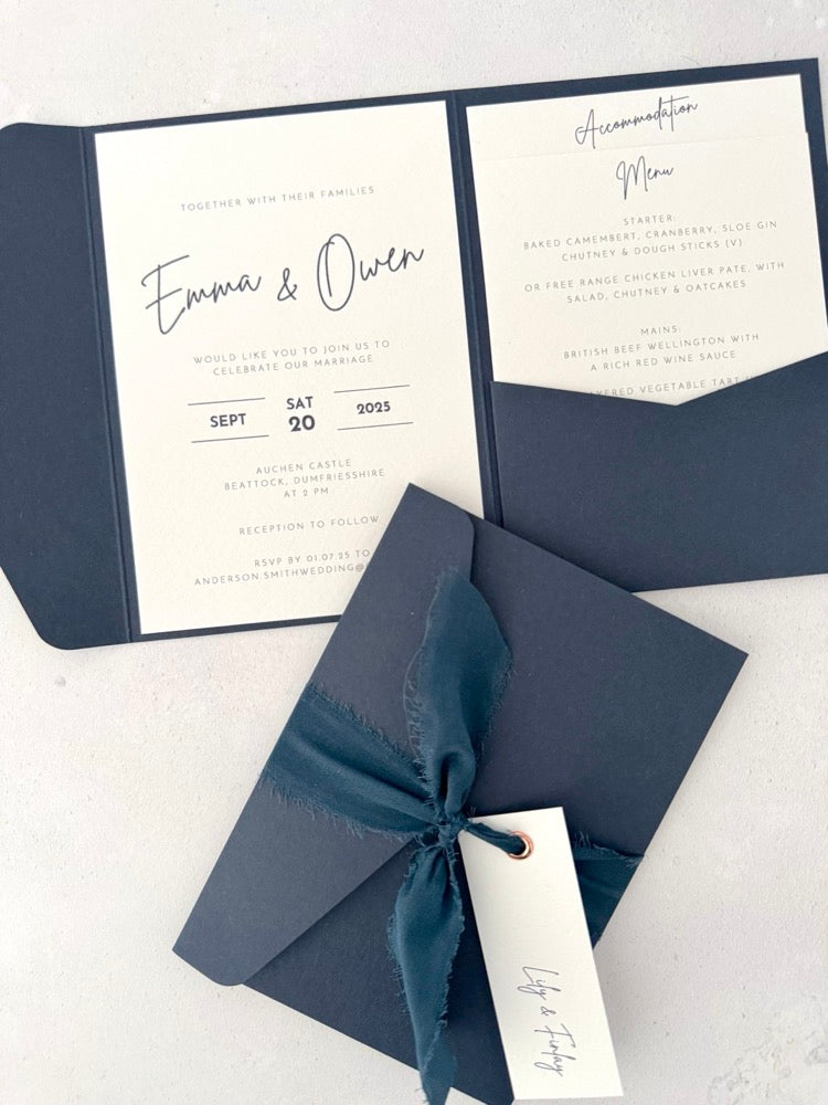 navy emma pocketfold wedding invite with 2 inserts for menu and accommodation details, with silk ribbon and guest name tag