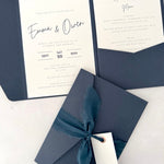 navy emma pocketfold wedding invite with 2 inserts for menu and accommodation details, with silk ribbon and guest name tag