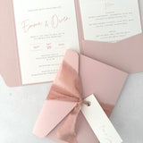 blush pink emma pocketfold wedding invite with 2 inserts for menu and accommodation details, with silk ribbon and guest name tag