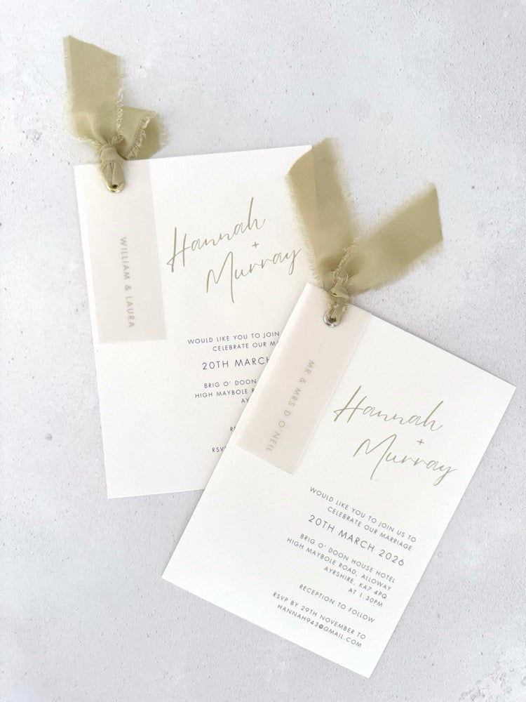 Sage green silk ribbon Hannah handmade wedding invite with printed guest names on vellum tags