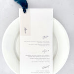 Handmade wedding menu with navy blue silk ribbon with personalised guest name on vellum