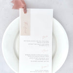 Blush pink silk ribbon and eyelet wedding day menu with personalised vellum tag for The Bride