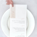 Blush pink silk ribbon and eyelet wedding day menu with personalised vellum tag for The Bride