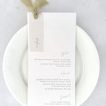 Wedding breakfast menu with sage green silk ribbon with personalised guest name printed on vellum with gold metal eyelet