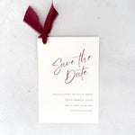 burgundy tied silk ribbon handmade save the date card with gold metal eyelet