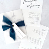 Navy Hannah vellum wrap wedding invite with tied silk ribbon and guest name tag. Insert card for wedding info and menu options. Brig O'Doon