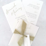 Sage green Hannah vellum wrap wedding invite with tied silk ribbon and guest name tag. Insert card for wedding info and menu options. Handmade by Zara 