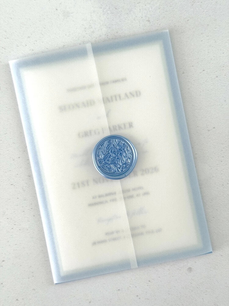 Transparent vellum wedding invite in dusty blue wax seal