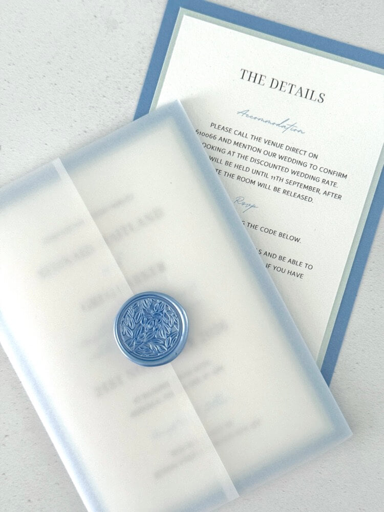 Jeni vellum jacket wrap wedding invite with cornflower blue wax seal