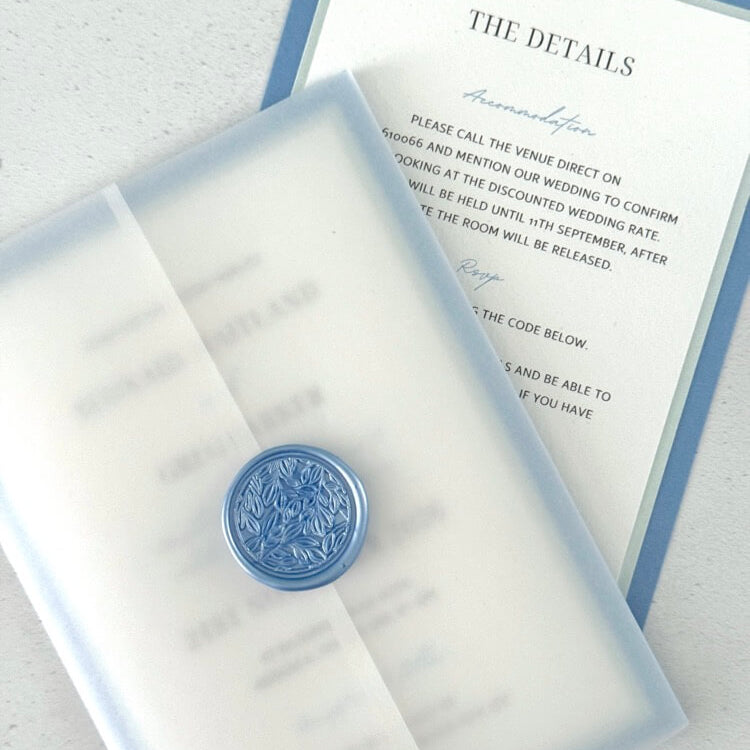 Jeni vellum jacket wrap wedding invite with cornflower blue wax seal
