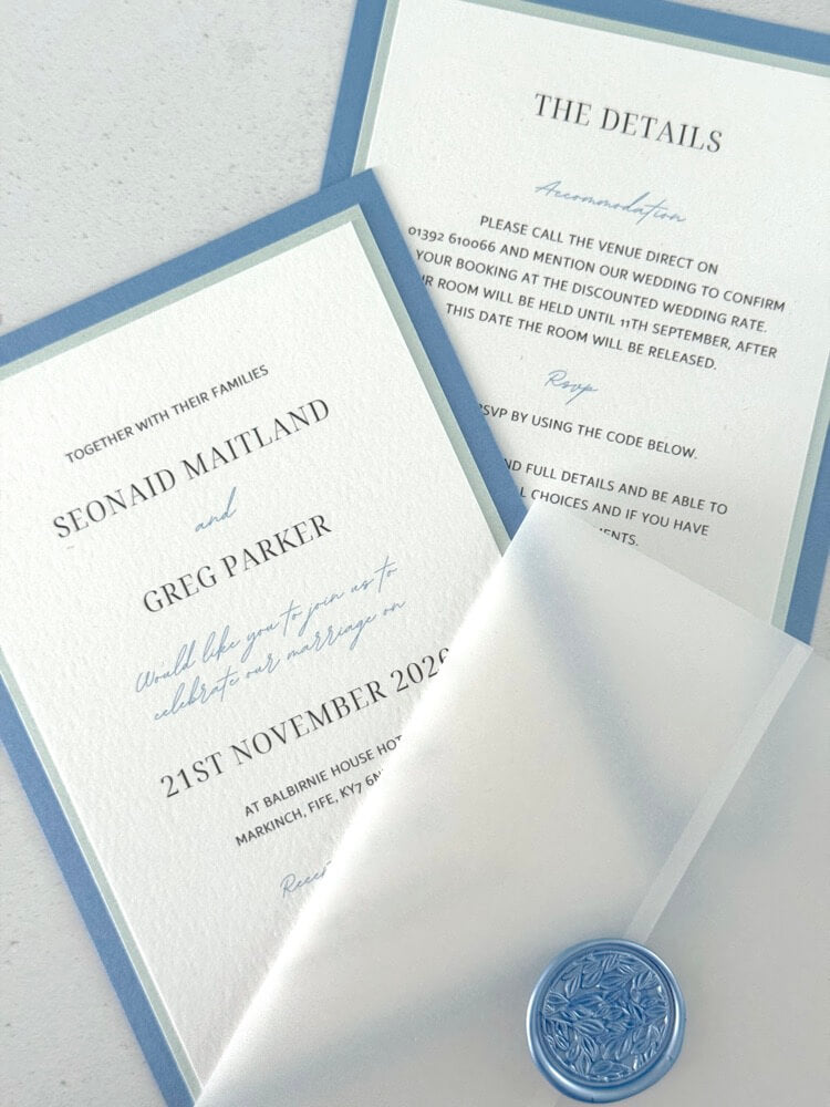 Jeni invite in dusky blue with info card and transparent vellum wrap handmade by zara dumfries