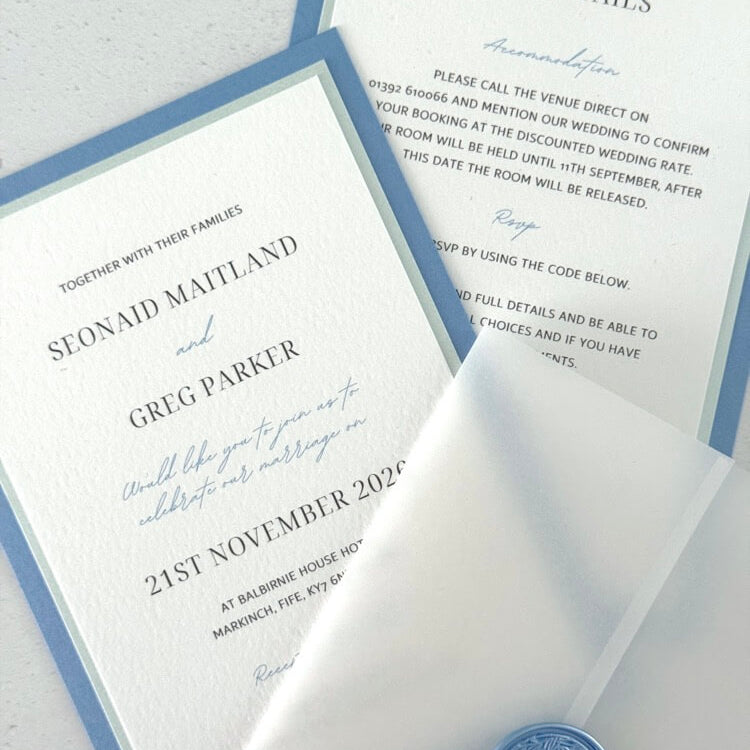 Jeni invite in dusky blue with info card and transparent vellum wrap handmade by zara dumfries