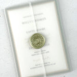 Handmade wedding invite with transparent vellum wrap and wax seal closure