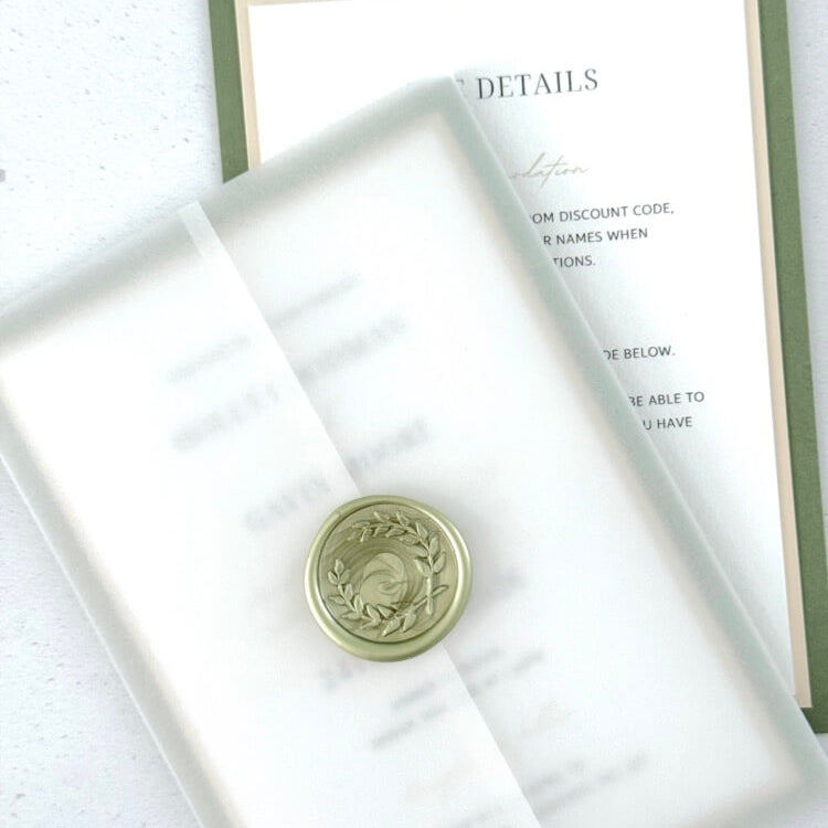 handmade wreath wax seal in sage green with see through vellum wrap wedding invite