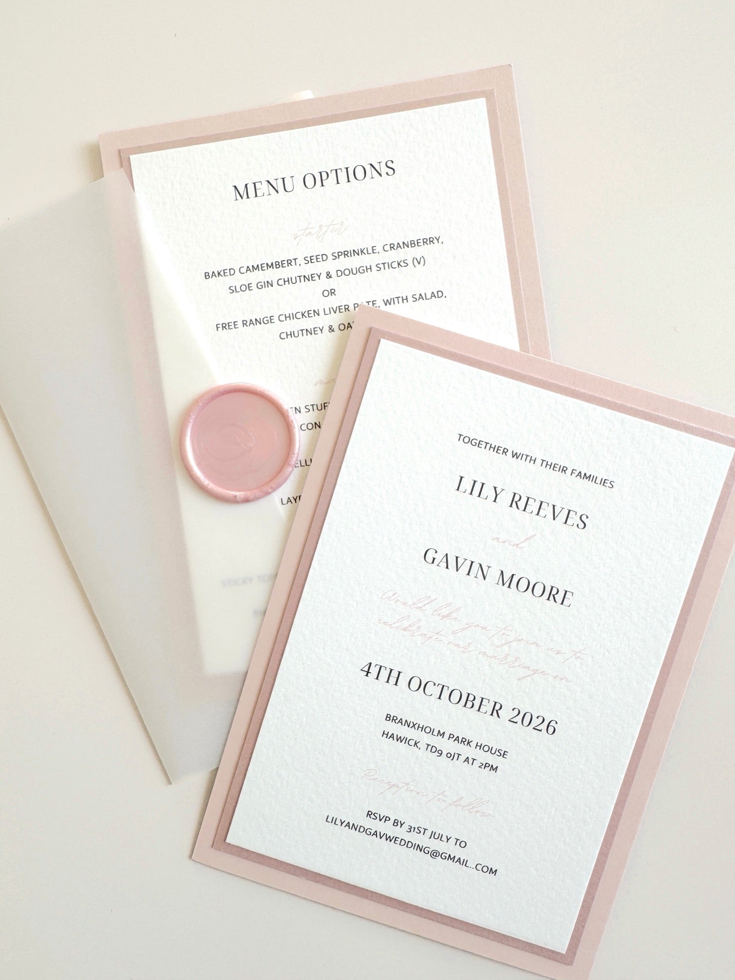 Transparent paper jacket wedding invite with wax seal in blush pink