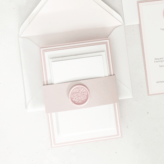 dusty pink leaf wax seal belly band stacked wedding invite