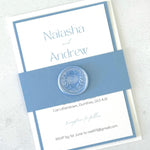 Wedding invitation card with blue and white design 