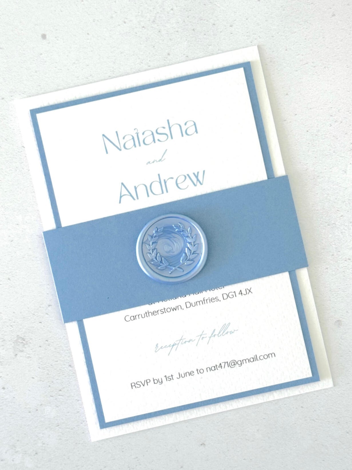 Wedding invitation card with blue and white design 
