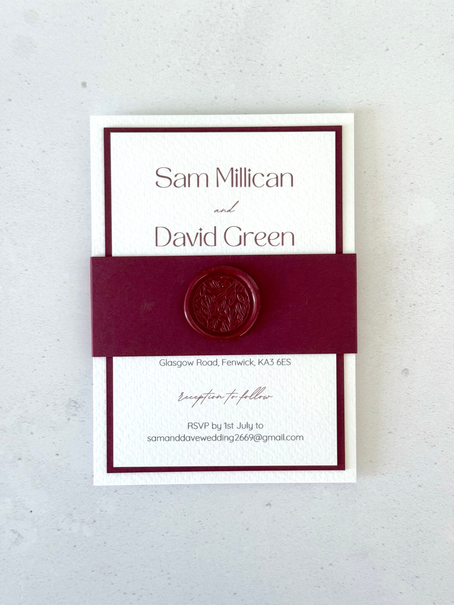 Burgundy and white layered wedding invitation with belly band and wax seal