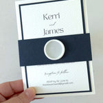 navy and white postcard wedding invite and details card with belly band and wax seal 