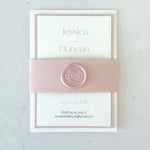 Pink handmade wedding invitation with belly band with wax seal