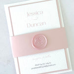 pink belly band and rose wax seal wedding invite